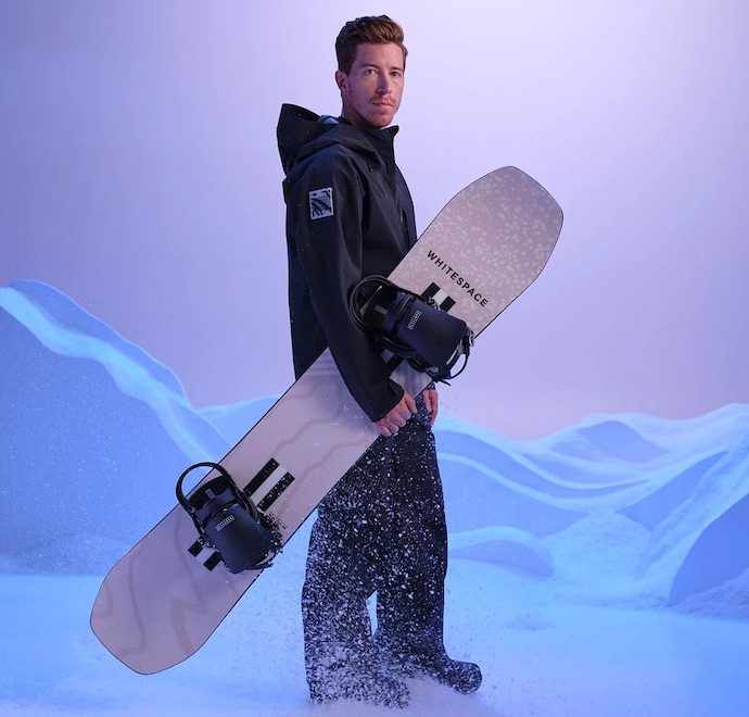 shaun white holds whitespace snowboard
