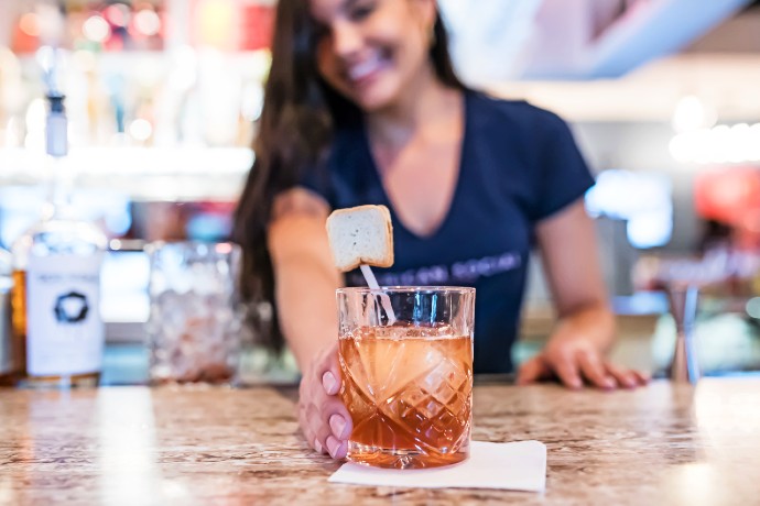 bartender serving PB&J Old Fashioned