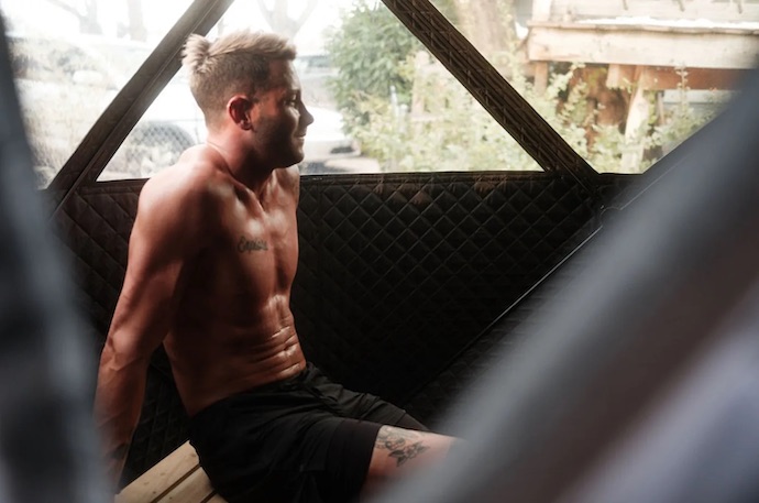man using sweattent sauna