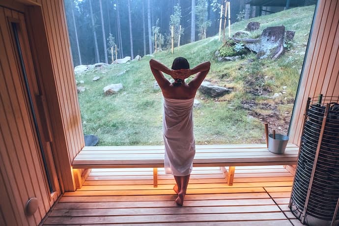 women in a swedish sauna looking out the window