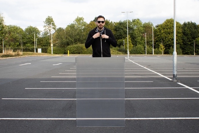 man stands behind Invisibility Shield