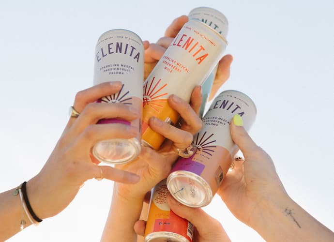 hands holding elenita canned cocktails
