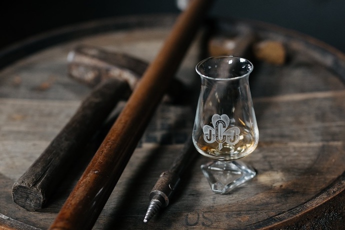 whiskey glass on a barrel
