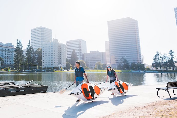 people carrying oru inlet kayak