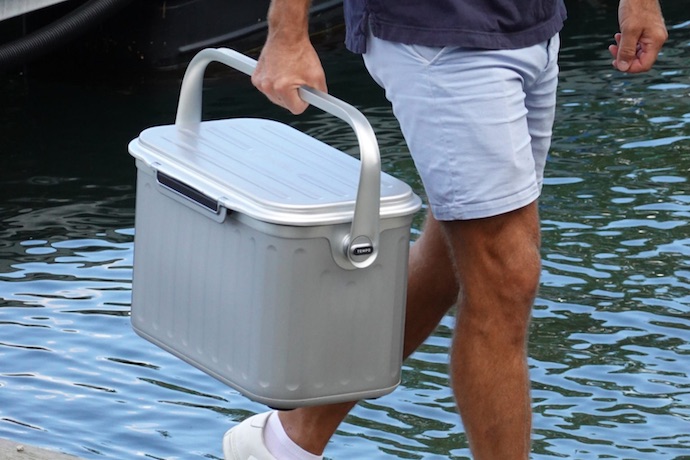 man carries the oyster tempo cooler