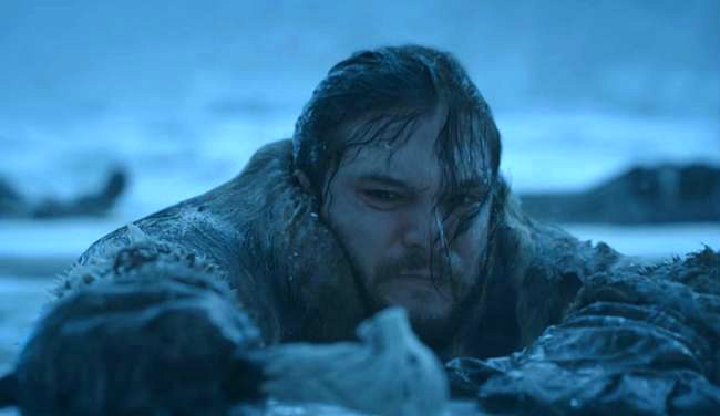 Jon Snow climbing out of water beyond the wall