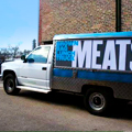 A Food Truck with Whole Pigs